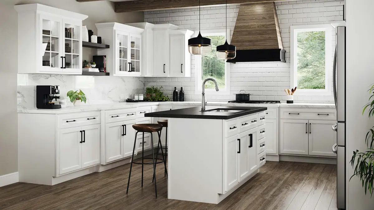 White kitchen with island and wood range hood