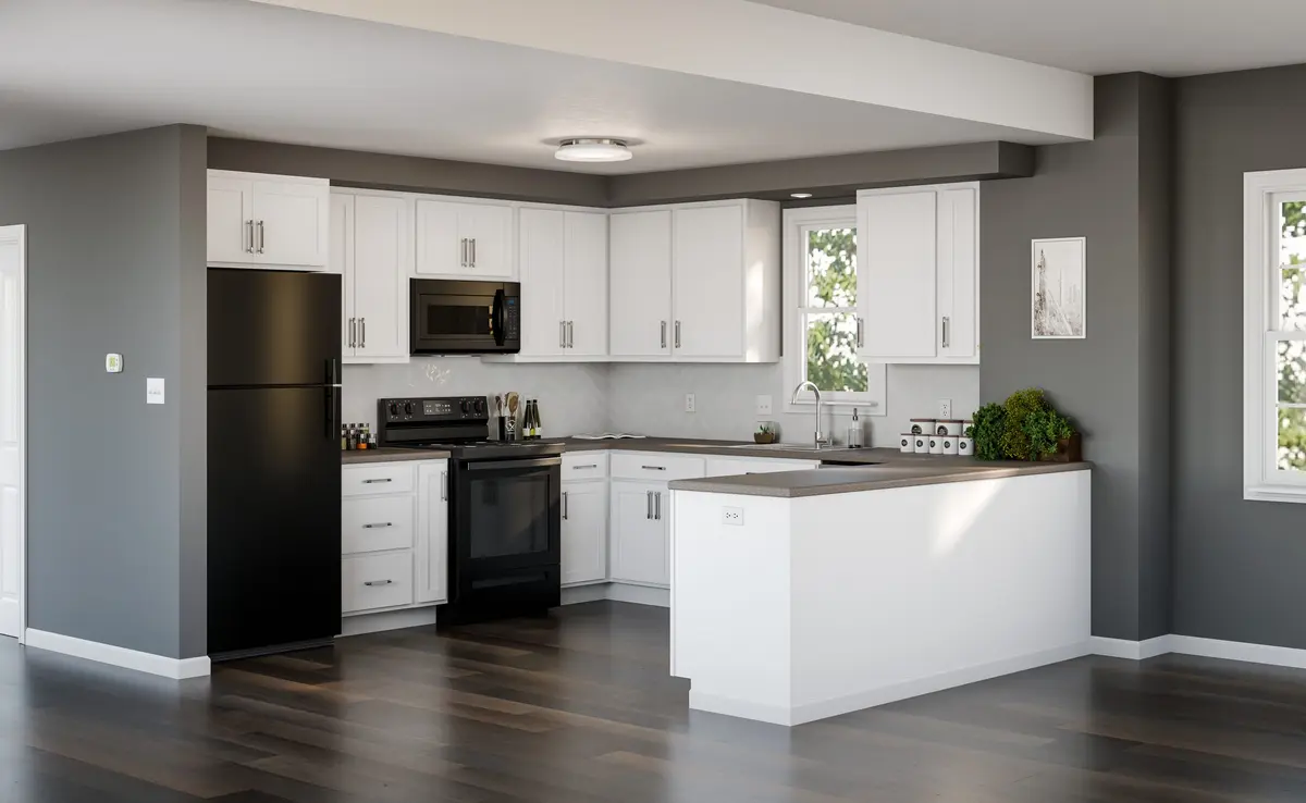 White kitchen with black appliances and peninsula